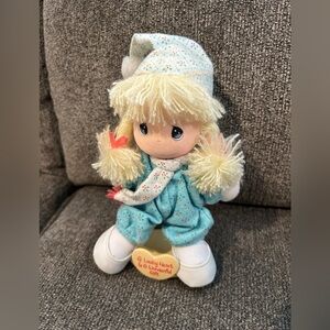 Precious MomentsCute Plush Doll with Blue Outfit on plastic stand. Vintage wtags